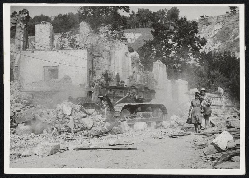 Greek Earthquake--Greece digs out after the recent earthquake which devastated the islands of the Ionian Sea Group. A Bulldozer pushes rubble out of a street in Argostoloian, the capital of Cephalonia, worst hit of the islands.