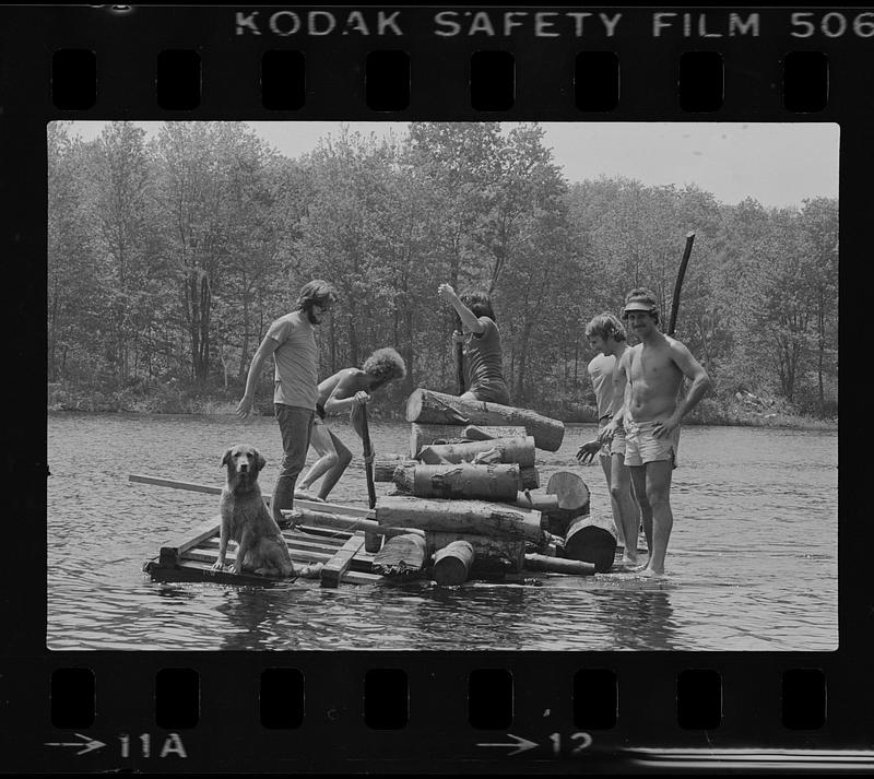 Group on wooden raft