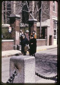 People gathered at the entrance to the courtyard of the Old North Church