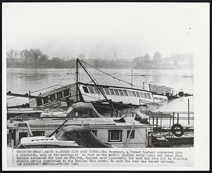 Cincinnati -- Night Club Boat Sinks -- The Showboat, a former towboat converted into a nightclub, sank at its mooring at he foot on the public landing early today and owner Jack Gratsch estimated the loss at $40,000. Gratsch said apparently the boat had been hit by floating objects moving downstream in the swollen Ohio river. He said the boat was beyond salvage.