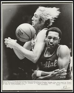 Braves-76ers-Philadelphia: Braves' George Wilson gets clobbered by 76ers' Connie Dierking (L) enough for the referee to declare a loose ball foul in the second period of play in Philadelphia, 11/13.