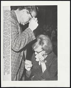 Tears of Joy -- Actress Edie Adams, who burst into tears today when a Los Angeles judge awarded her custody of the late Ernie Kovacs' two children, wipes her eyes as she thanks her attorney, Murray Chotiner, a few moments after the decision. The court ruled that both Miss Adams and the girls' real mother, Mrs. Betty Kovacs, are "fit and proper" guardians but that the girls "are of sufficient age to form an 2intelligent preference."