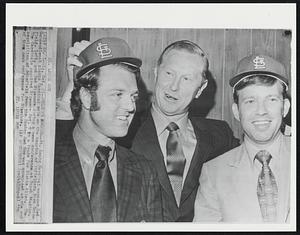 Welcome Aboard - St. Louis Cardinals manager Red Schoendienst plants Cardinal caps on the noggins of infielders Dick Schofield, left, and Ted Sizemore during a news conference at Busch Stadium. The Cardinals acquired Sizemore Oct. 5 in a trade for Richie Allen. The acquisition of Schofield from the Boston Red Sox was announced at the end of the news conference for Sizemore.