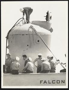 Bell That Saved 33. Used for the first time in emergency operations, this bid diving bell newly-developed by the U.S. Navy, saved lives of 33 men in four dramatic trips to the Squalus which dived to the bottom off Portsmouth, N.H., partly flooded and unable to rise. This picture shows sailors of the rescue ship Falcon conditioning the bell for further work in salvaging the submersible May 25.