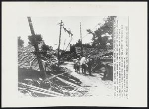 Quake Damage In Morita -- Japanese Nationals ease their way today down rubble strewn street of Morita, Japan, located in the midst of the earthquake area of Fukui prefecture. Except for the hospital, most of Morita was leveled in the Monday disaster.