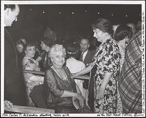 Mrs. Carlos M. de Heredia standing, talks with as the Rev. Ralph Putney standing left, Mrs. Cornelius Hollister of Toledo, Ohio, and Ted Shawn in box near, look on