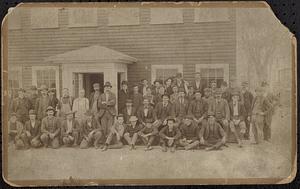 Harp shop workers in front of building