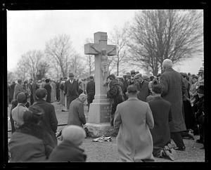 Woman kissing the feet of Jesus Christ on the cross