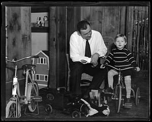 Jack Sharkey with his son, who is on a tricycle