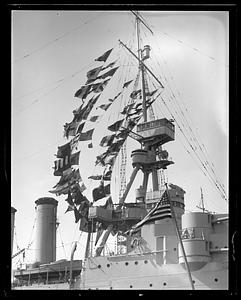 USS Milwaukee in Navy Yard with pennants flying
