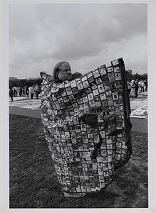 Man wearing cloak made of one year of AIDS obituaries in Texas