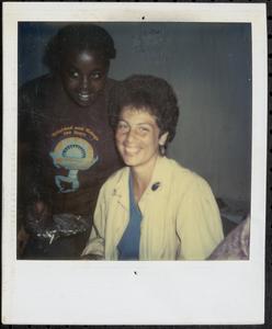Two women posing and smiling