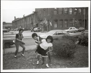Three young women being silly outside