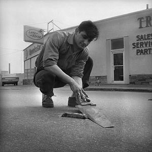 Removing bump in road, Purchase Street, New Bedford