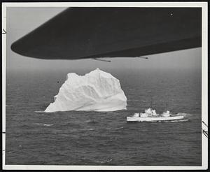 International Ice Patrol - 1948. This shot was made from under the wing of a converted B-17, a dangerous bit of rendezvous, plane - berg - and the USCGC Mendota. Taken from a converted B-17. Opportunities to take photos such as this come few and far between because of persistent fogs that blanket the Grand Banks area after the first of May. Combined air and surface operations and the effective use of radar and loran by Coast Guard patrol units contributed to the success of the 1948 International Ice Patrol. It was the mission of the 1948 patrol to locate and report ice conditions constituting a menace to navigation, to determine set and drift of icebergs, to collect weather information and surface and sub-surface oceanographic data, and to keep all interested parties and commercial shipping informed thereof. The importance to mariners of “ice broadcasts” is evidence by the fact that practically all commercial radio transmission ceases during these broadcasts. The International Ice Patrol along the steamer lanes of the North Atlantic is conducted by the United States Coast Guard. Coast Guard cutters and planes assigned to the patrol are based at Argentina, Newfoundland.