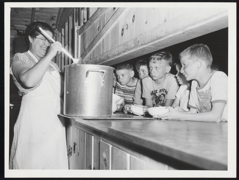 Plum Island - Mrs. Margaret MacGonagle, cook, smilingly dishes out soup to the hungry campers