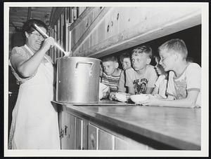 Plum Island - Mrs. Margaret MacGonagle, cook, smilingly dishes out soup to the hungry campers