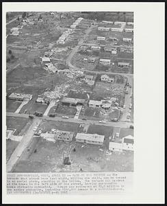 Strongsville, Ohio – Path Of The Twister – The tornado that struck here last night, killing one child, can be traced in an aerial photo, starting at the bottom. The tornado hit the hardest at the homes on the left side of the street, leaving surrounding homes virtually untouched. Damage was estimated at $1.5 million to the entire community, including $100,000 damage to a catholic church.