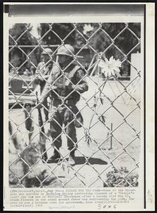 A Flower for the Park--Some of the thousands who marched in Berkeley Friday protesting closure of a "People's Park" and the use of National Guardsmen after a bloody riot May 15, stuck flowers in the steel meshes fence now surrounding the park. The area is now a bivouac area for guardsmen.