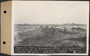 Contract No. 80, High Level Distribution Reservoir, Weston, impervious material being placed and rolled, looking southeast from Sta. 27+30 dam 1, high level distribution reservoir, Weston, Mass., Oct. 19, 1939