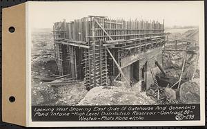 Contract No. 80, High Level Distribution Reservoir, Weston, looking west showing east side of gatehouse and Schenck's Pond intake, high level distribution reservoir, Weston, Mass., Apr. 17, 1940