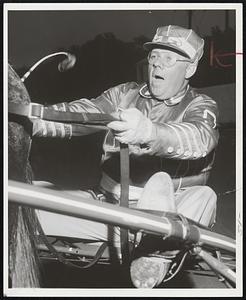 Singing While you Work- Frank Safford leading driver at Foxboro, can't out of habit of singing while warming up horses before a race.