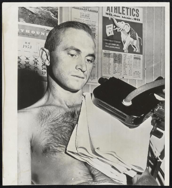 Bobby Shantz, who usually gives opposing batters the treatment, takes a little of same himself as he gets treated for sore shoulder in the dressing room at Connie Mack Stadium. The Philadelphia A's pitcher suffered the injury in Boston last week.