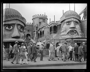 People walking past part of an recreational facility called Dragons Pit