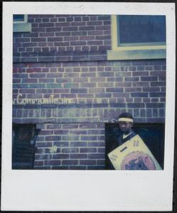 Boy with headband and shield outside Newtowne Court