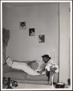 Crystal Smith lounging on a couch