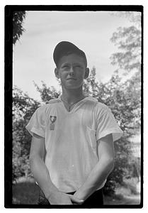 A boy with an medal pinned on his shirt