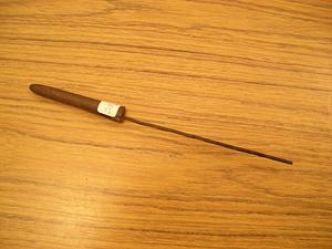 Long narrow metal tool