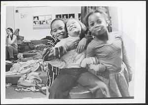 Three girls posing and laughing