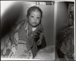 Toddler being held up to the camera