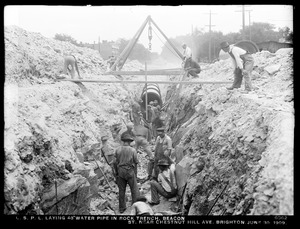 Distribution Department, Low Service Pipe Lines, laying 48-inch pipe in rock trench, Beacon Street near Chestnut Hill Avenue, Brighton, Mass., Jun. 30, 1909