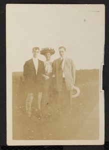 Portrait of two men and a woman