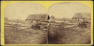 Barn and stacks of lumber