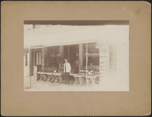 Hiram Watts in front of his store on Pleasant St.