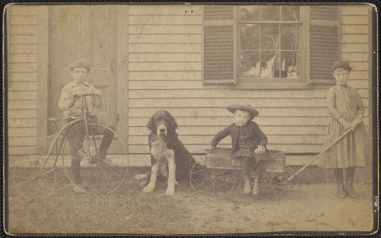 Two boys, one girl, with dog
