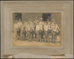 Postmen in front of Newburyport Post Office, Inn St. mailmen are wearing winter and summer hats, c. 1925