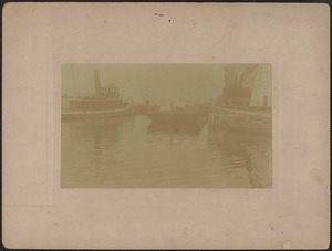 Tug and barge at waterfront