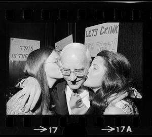 An elderly lottery winner gets kissed for the cameras, Boston TV studio