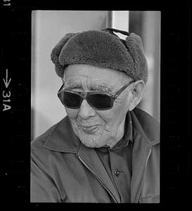 A man wearing a hat and sunglasses, Alaska