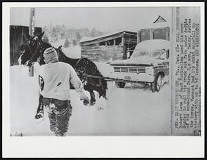East Montpelier, Vt. - Real Horsepower. Robert Lane of East Montpelier used his mare Sunday to pull his truck out from under of his snow-bound farm. His son, Teddy, drives the horse. Vermont had its worst snowfall in history with up to 45 inches.