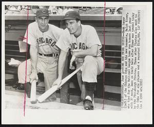 Pittsburgh – Home Run Twins United – Hank Sauer (left) of the Chicago Cubs and his new teammate, Ralph Kiner, who tied for the National League home run honors last year with 37 each, lean on their bats after Kiner was traded today by the Pittsburgh Pirates. Three other Pirates also went to the Cubs for six players and a reported $100,000.