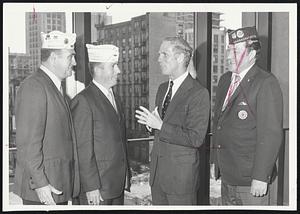 Parade Plans for the observance of Veterans Day in Boston tomorrow are discussed by Mayor White (right) with representatives of Suffolk County Council, American legion - William Coughlin left), sergeant at arms, and John P. Comer, parade chairman and senior vice commander. White is honorary chief marshal.