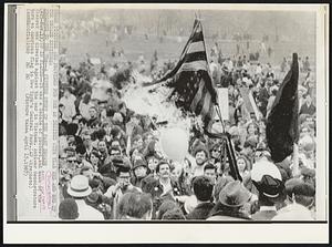 Prologue To The 70s – A Picture Story Of The Past Decade. Up in Flames – It was a decade of protest, and much of the dissent was directed against the war in Vietnam. Antiwar demonstrators burn an American flag in New York’s Central Park.
