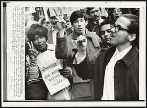 Changing Draft Protest--Onlookers watch during a card-burning protest staged by a young man recently in Dallas. The thrust of draft protest has turned to less visible means as draft counseling centers have come into being to help young men fight the system from within the system.