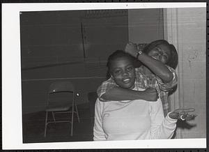 Two young women making silly poses