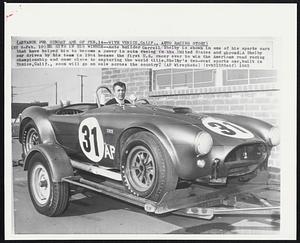 With Venice, Calif., Auto Racing Story. He Sits In His Winner -- Auto builder Carroll Shelby is shown in one of his sports cars that have helped him to become a power in auto racing in the United States and abroad. A Shelby car driven by his team in 1964 became the first U.S. racer ever to win the American road racing championship and came close to capturing the world title. Shelby’s two-seat sports car, built in Venice, Calif., soon will go on sale across the country.